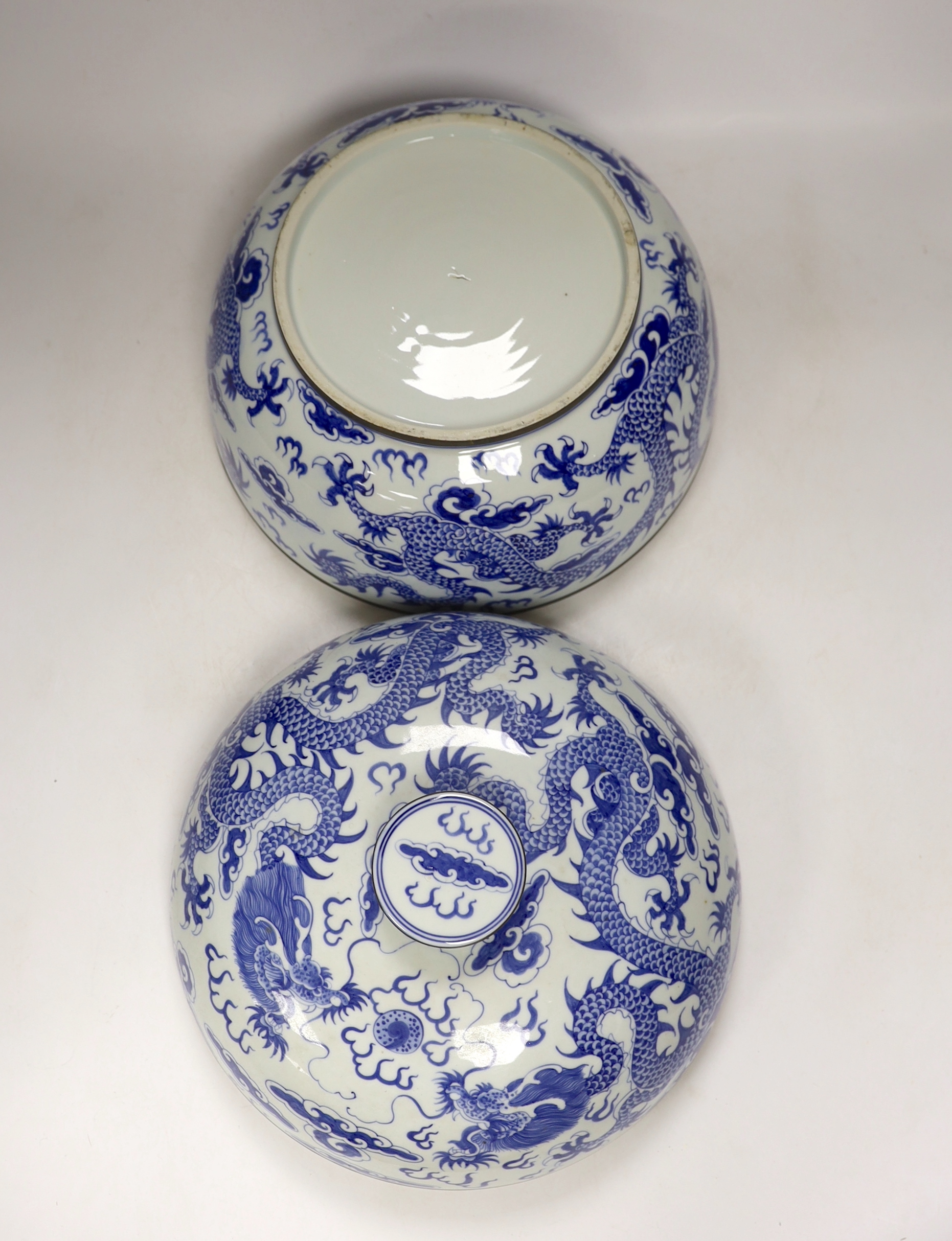 Four modern Chinese blue and white ceramic items; two teapots, a lidded vessel and a bowl, tallest 23.5cm
